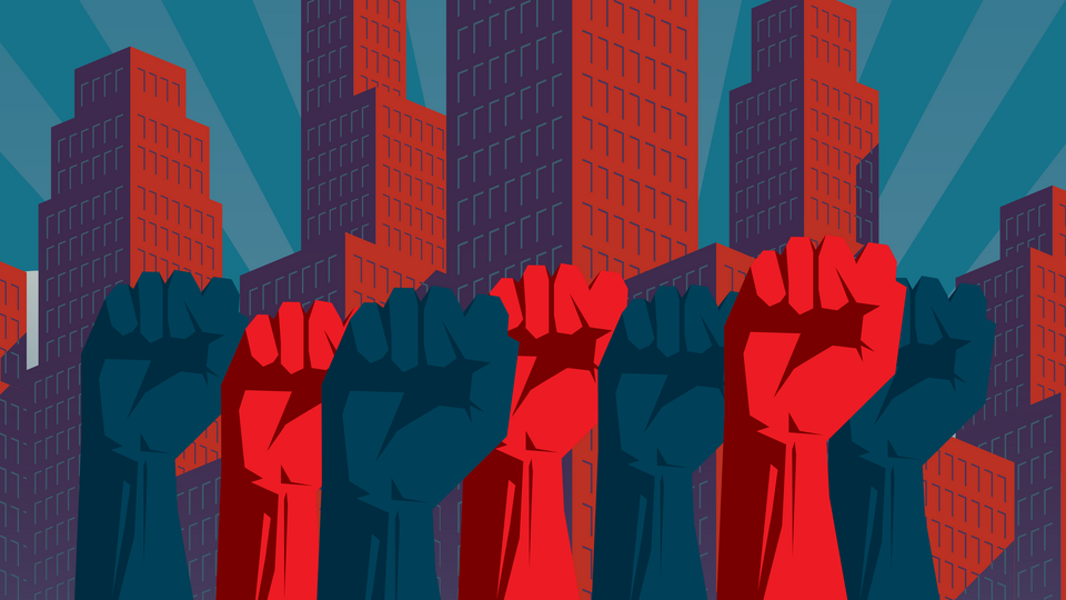 Red and blue fists in front of skyscrapers